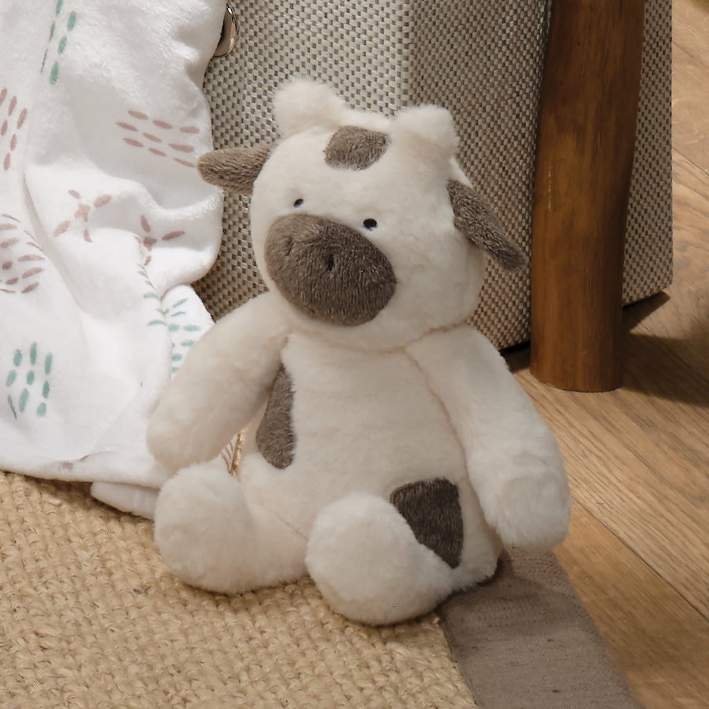 Peluche de vache en fausse fourrure blanche