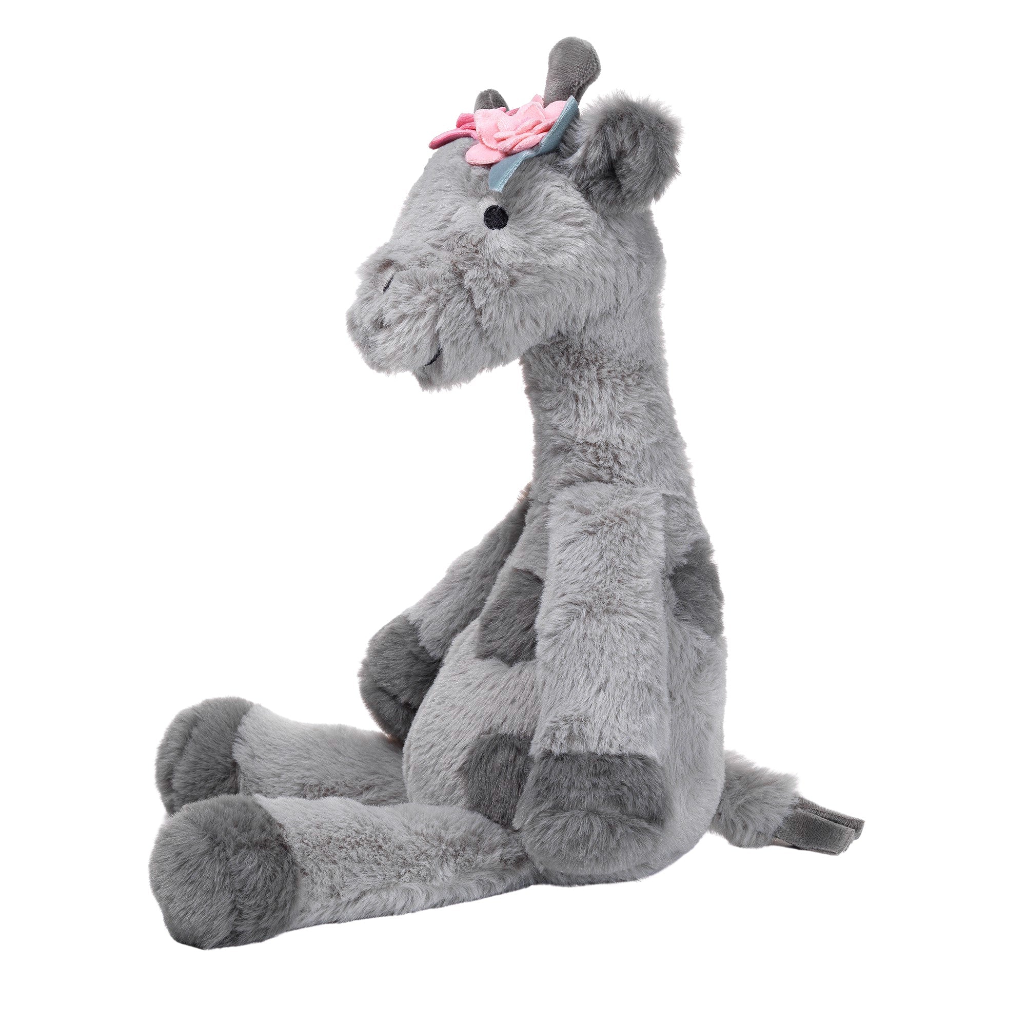 Girafe en peluche grise avec des fleurs