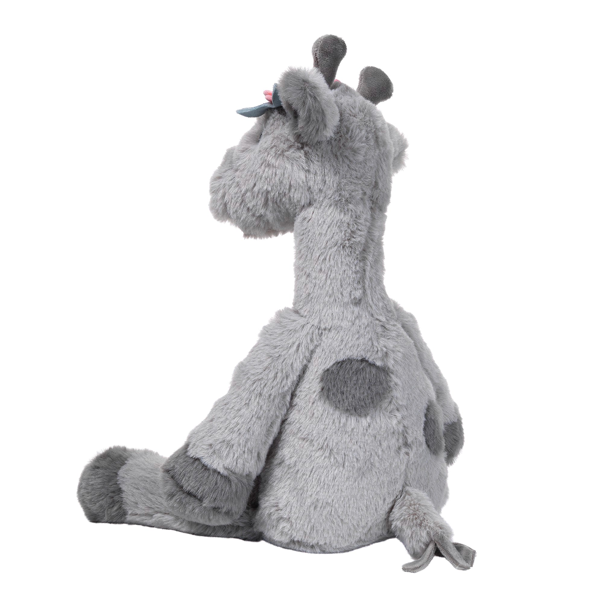 Girafe en peluche grise avec des fleurs